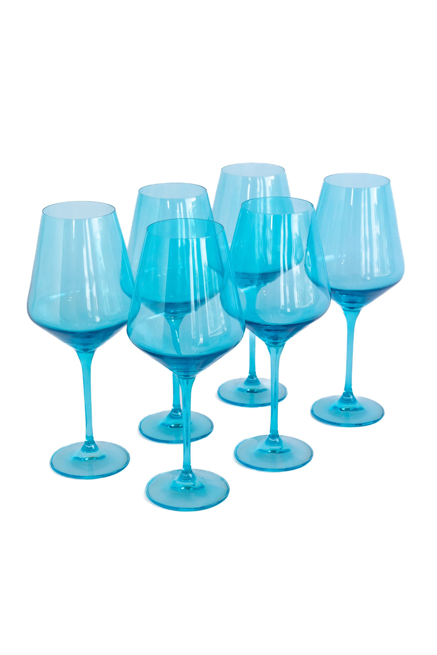Elegant ocean blue wine glasses set on a pristine table, capturing the essence of luxury and coastal charm.