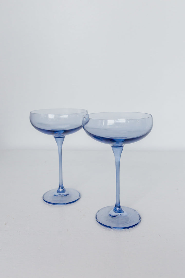 Elegant cobalt blue champagne coupes set for sophisticated celebrations and upscale events