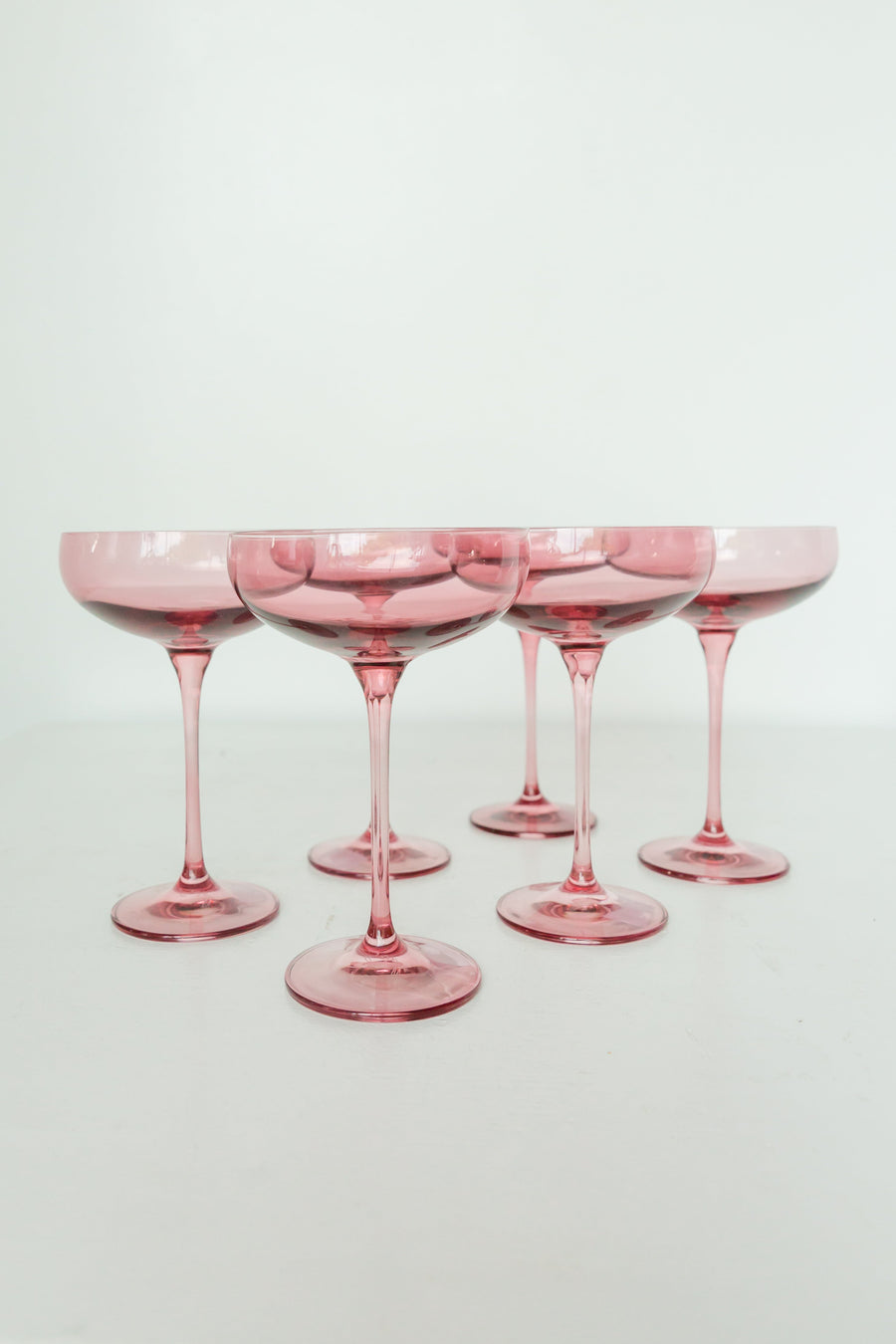 Elegant champagne coupe glass filled with sparkling bubbly, perfect for refined celebrations and toasts.