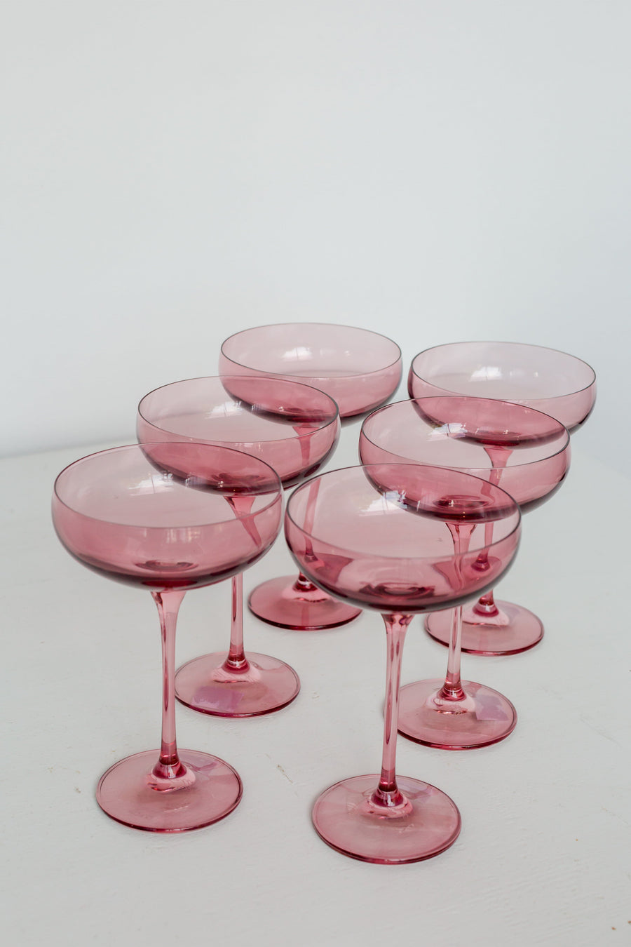 Elegant champagne coupe glass filled with sparkling bubbly, perfect for refined celebrations and toasts.