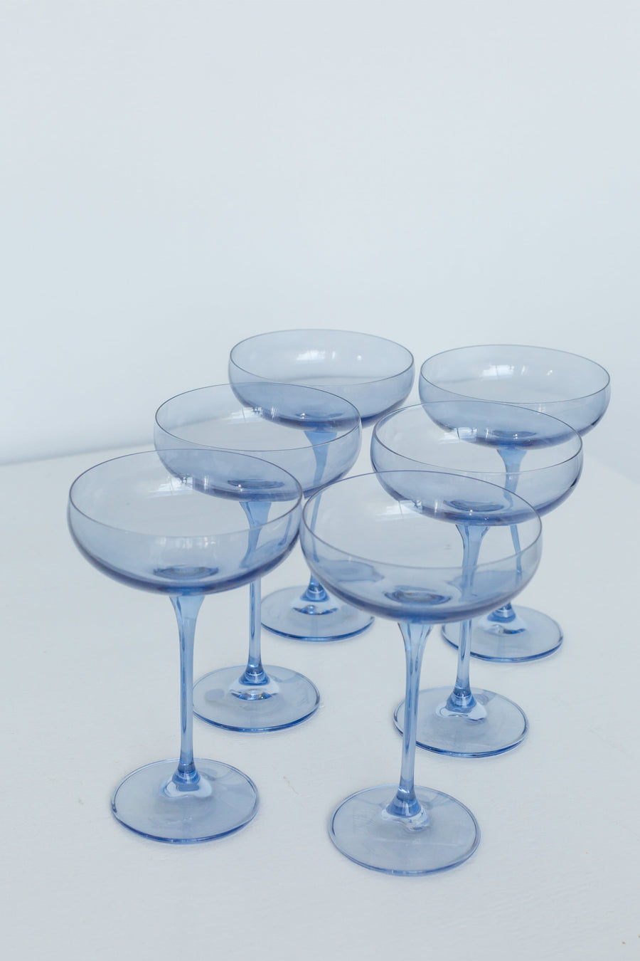 Elegant cobalt blue champagne coupes set for a luxurious celebration with refined glassware