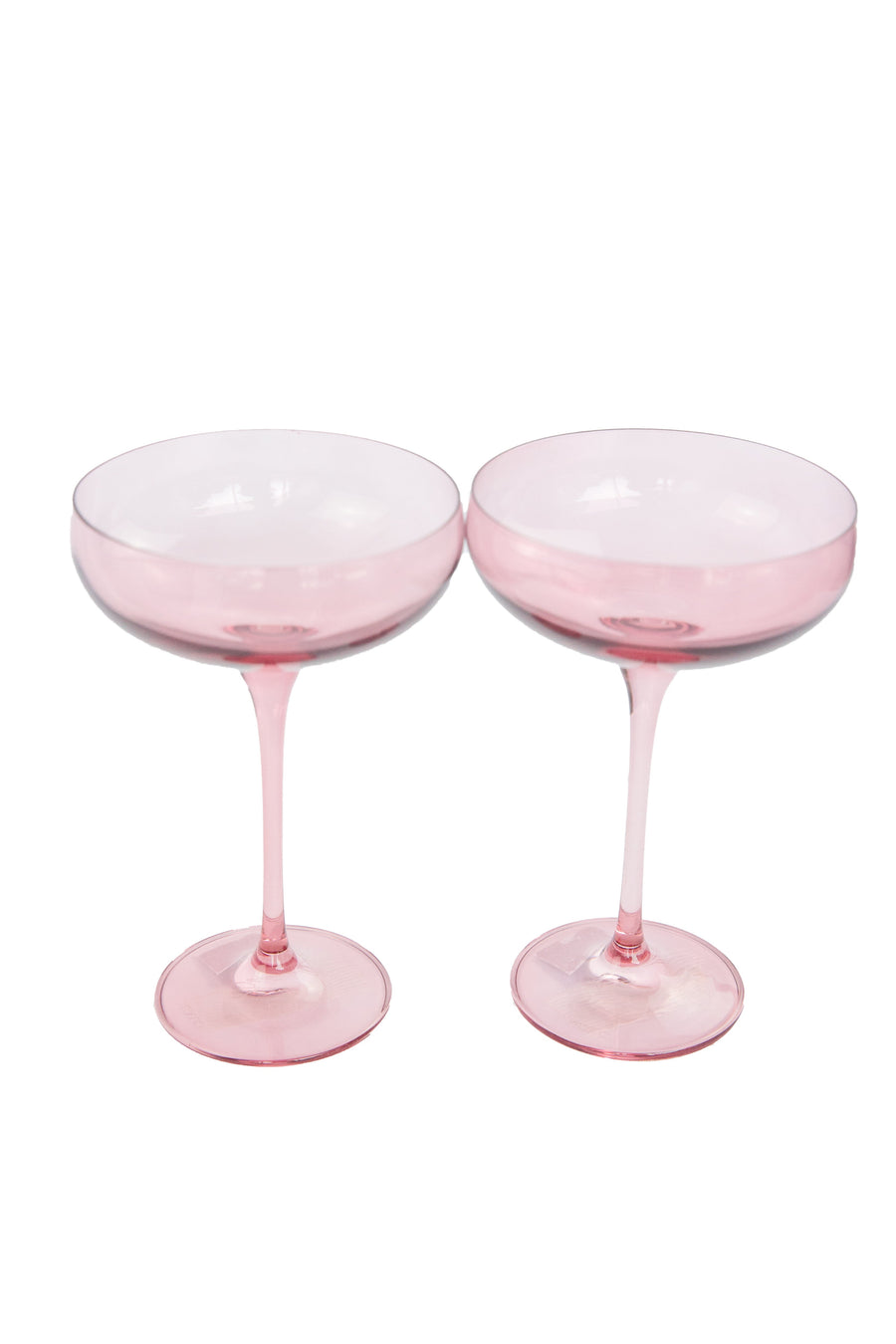 Elegant rose bouquet paired with fine champagne glass, perfect for sophisticated celebrations and romantic occasions.