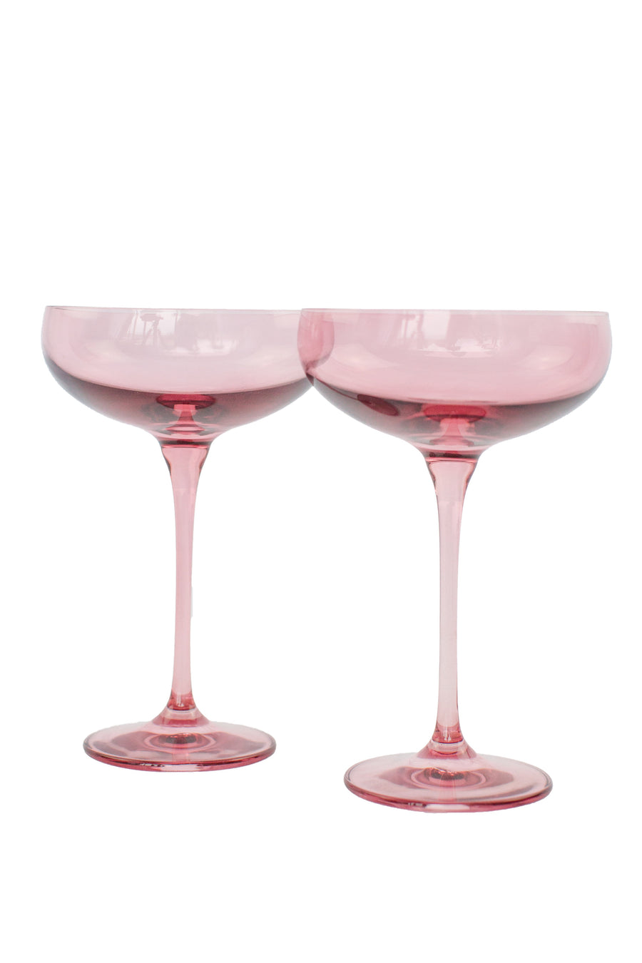 Elegant rose bouquet paired with fine champagne glass, perfect for sophisticated celebrations and romantic occasions.