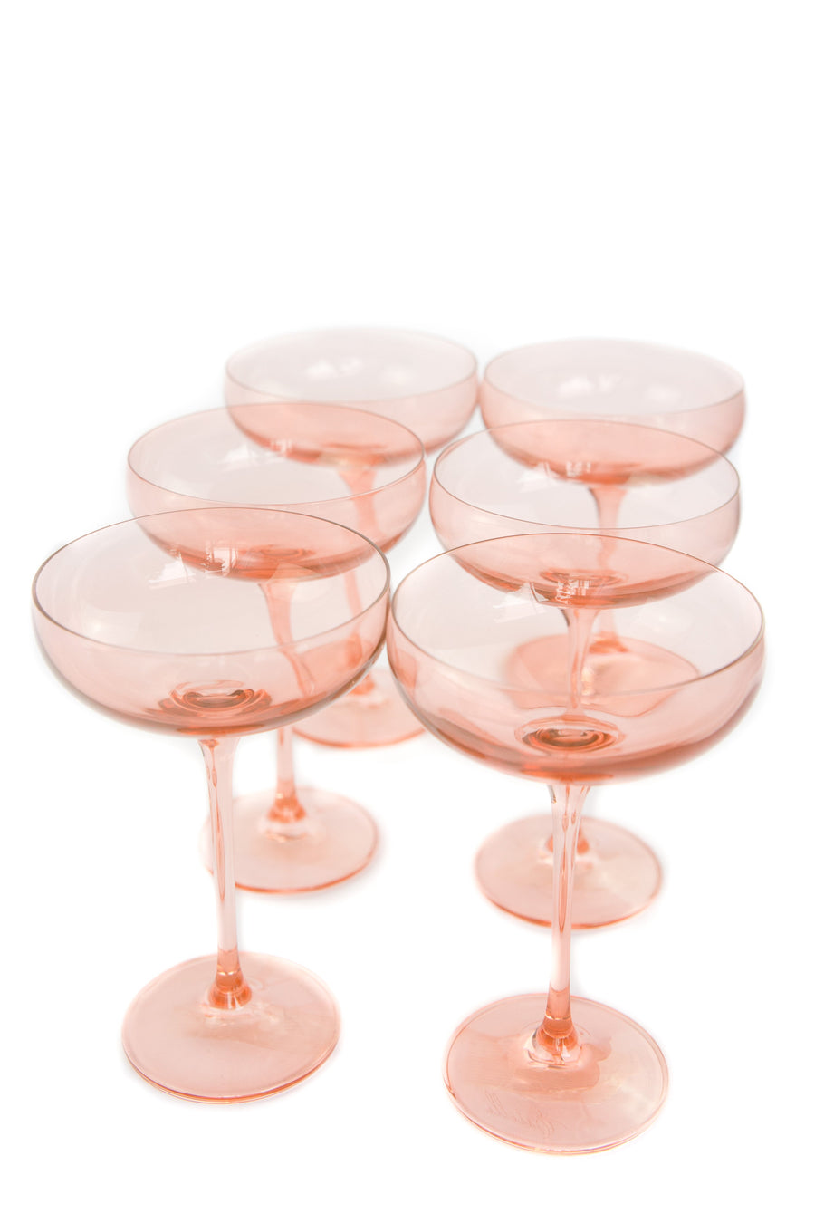 Elegant blush pink champagne coupes perfect for sophisticated celebrations and stylish toasts.