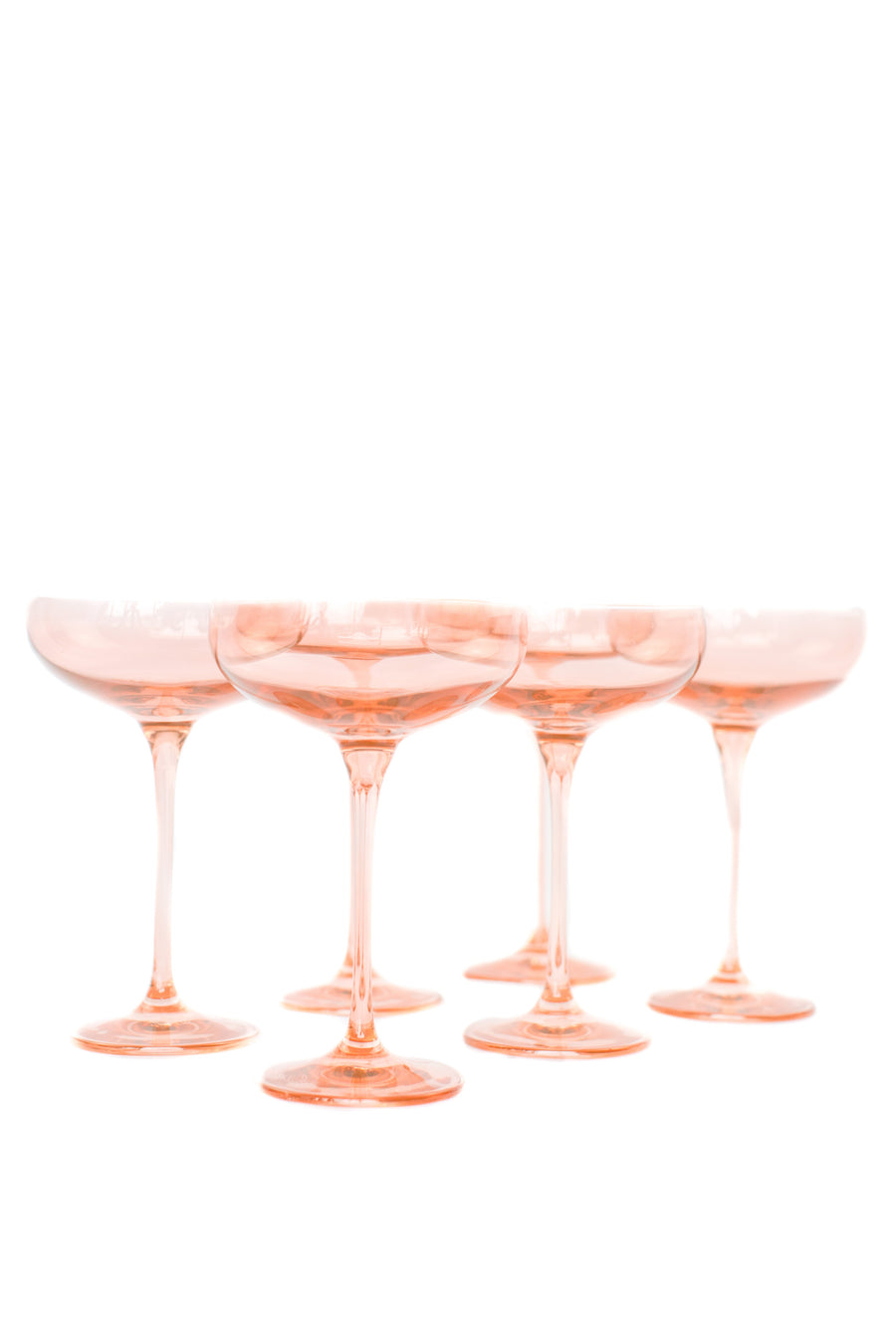 Elegant blush pink champagne coupes perfect for sophisticated celebrations and stylish toasts.