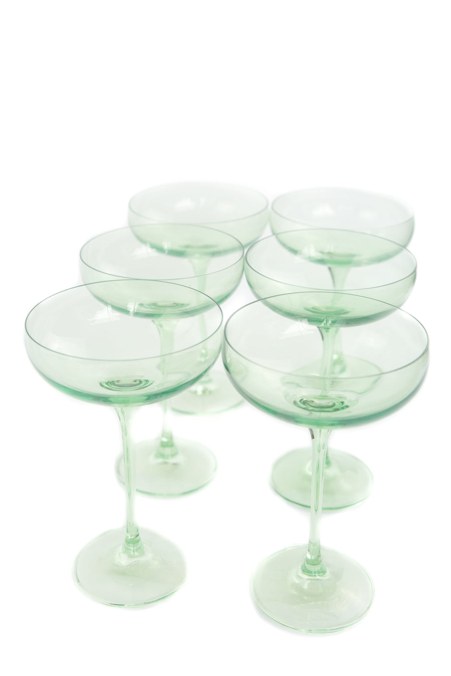 Mint green champagne coupes elegantly displayed for sophisticated event decor and stylish table settings.