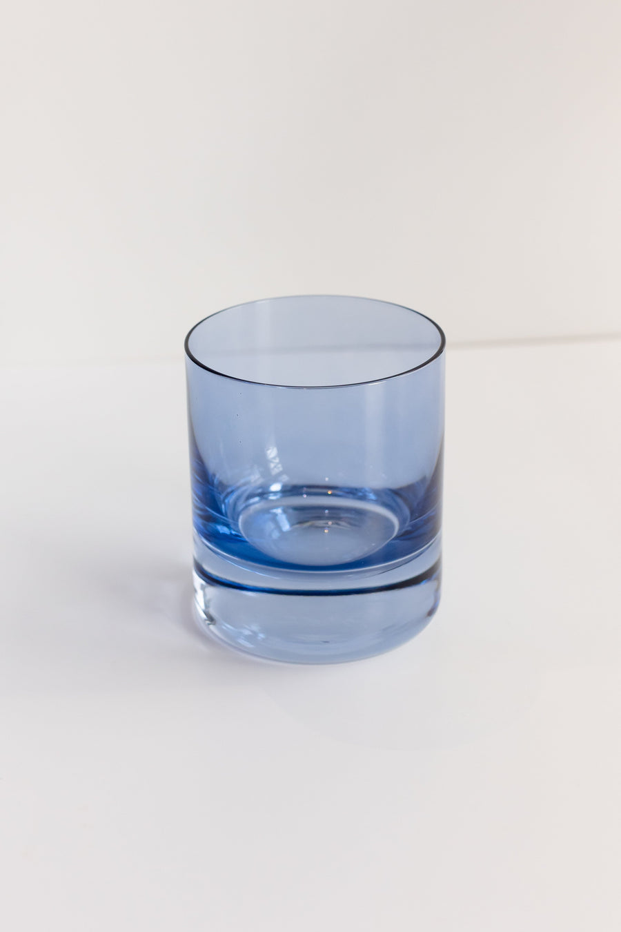 Cobalt blue rocks glass showcasing elegant design and vibrant color, perfect for stylish beverage presentation