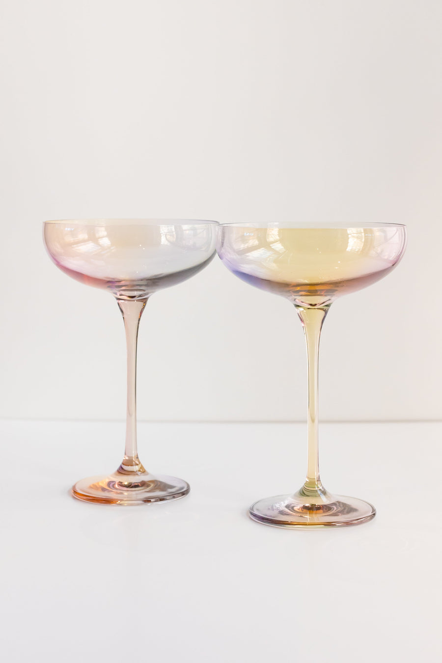 Elegant iridescent champagne glass reflecting soft light, perfect for sophisticated celebrations and stylish events.