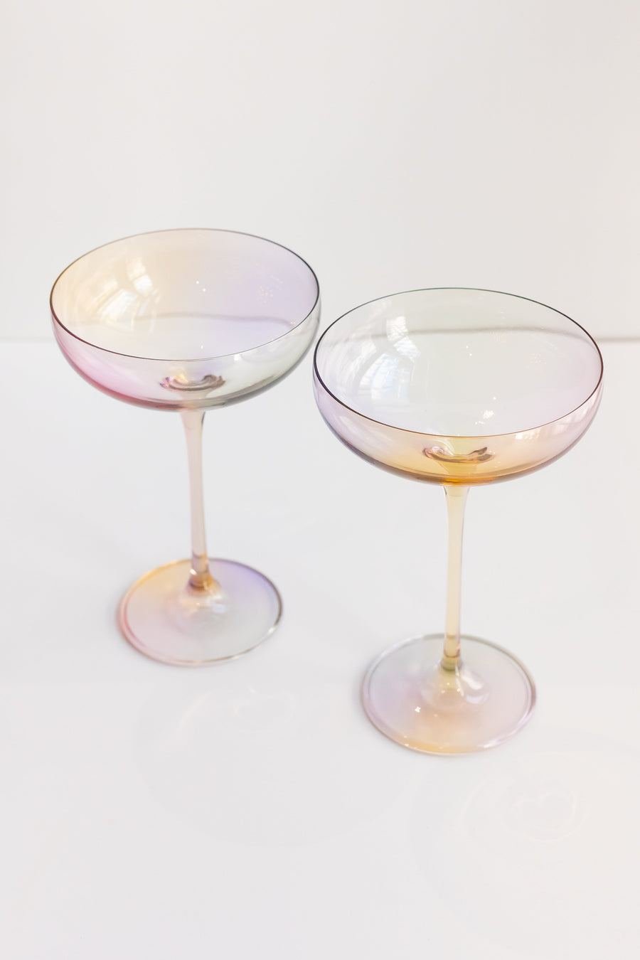 Elegant iridescent champagne glass reflecting soft light, perfect for sophisticated celebrations and stylish events.