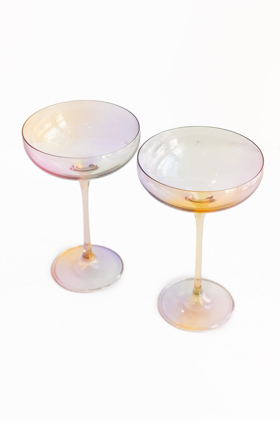 Elegant iridescent champagne glass reflecting soft light, perfect for sophisticated celebrations and stylish events.