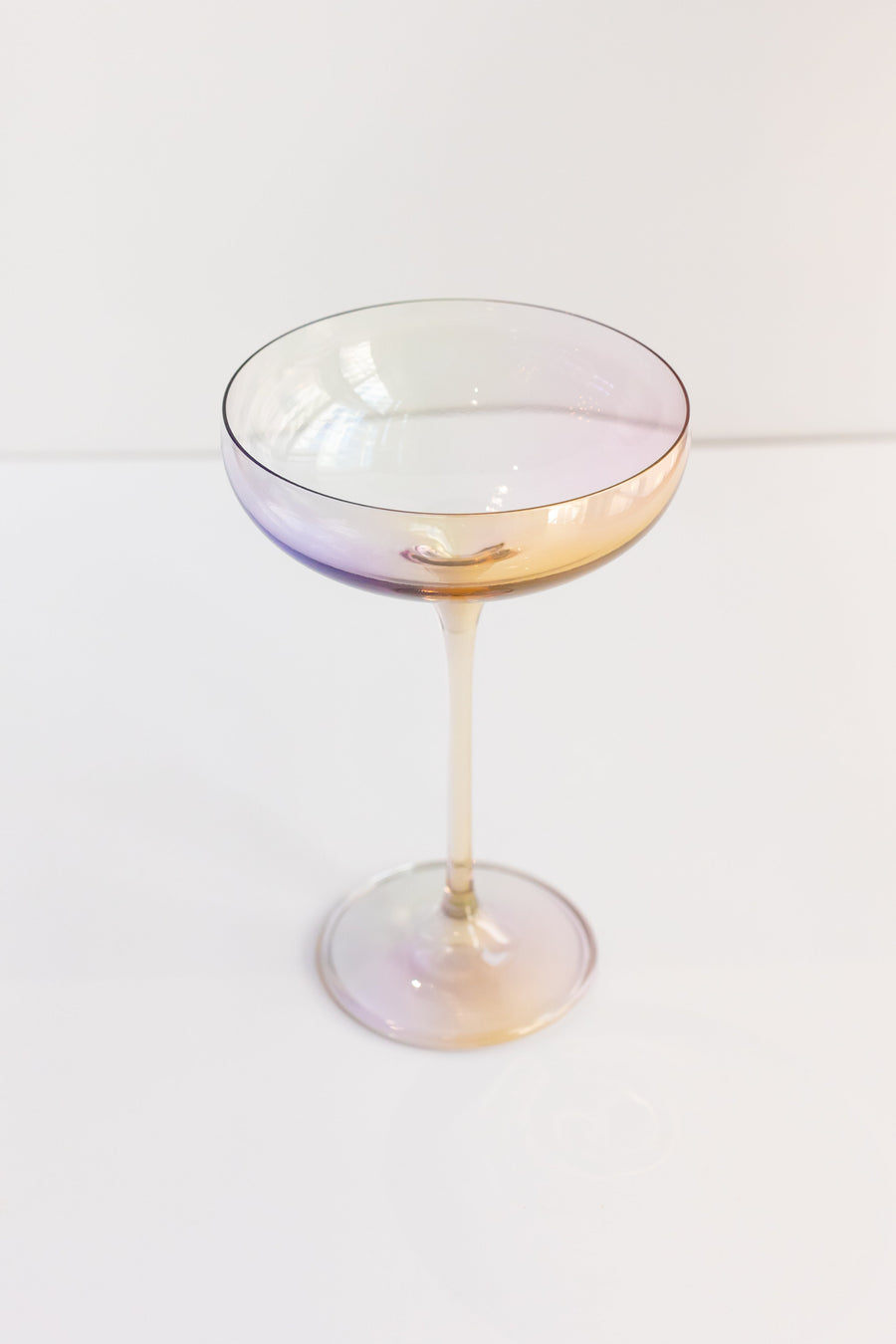 Elegant iridescent champagne bottle reflecting soft light, perfect for sophisticated event decor and celebrations.