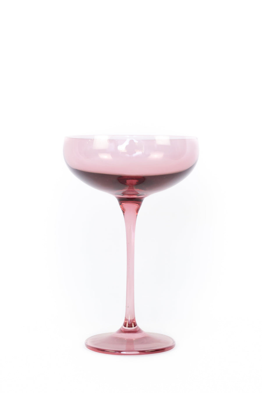 Elegant rose bouquet paired with fine champagne glass, perfect for sophisticated celebrations and romantic occasions.