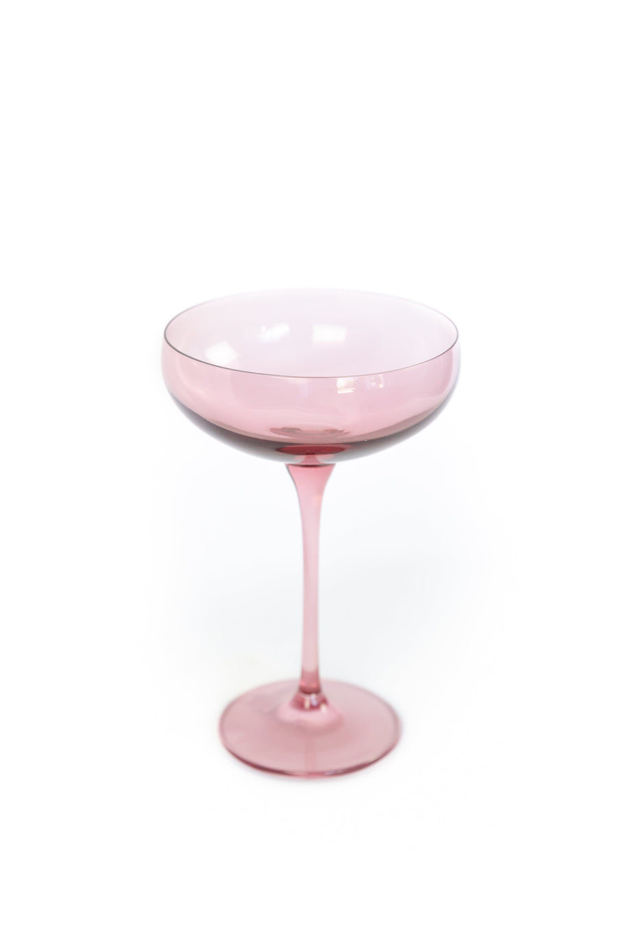 Elegant rose bouquet paired with fine champagne glass, perfect for sophisticated celebrations and romantic occasions.