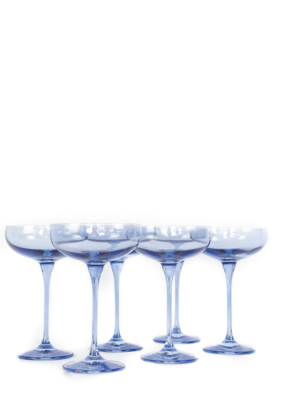 Elegant cobalt blue champagne coupes set for a luxurious celebration with refined glassware