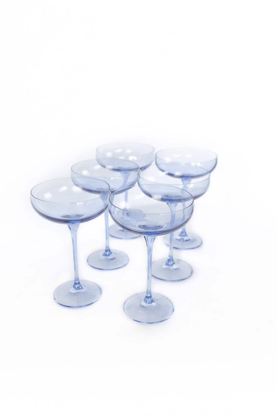 Elegant cobalt blue champagne coupes set for a luxurious celebration with refined glassware