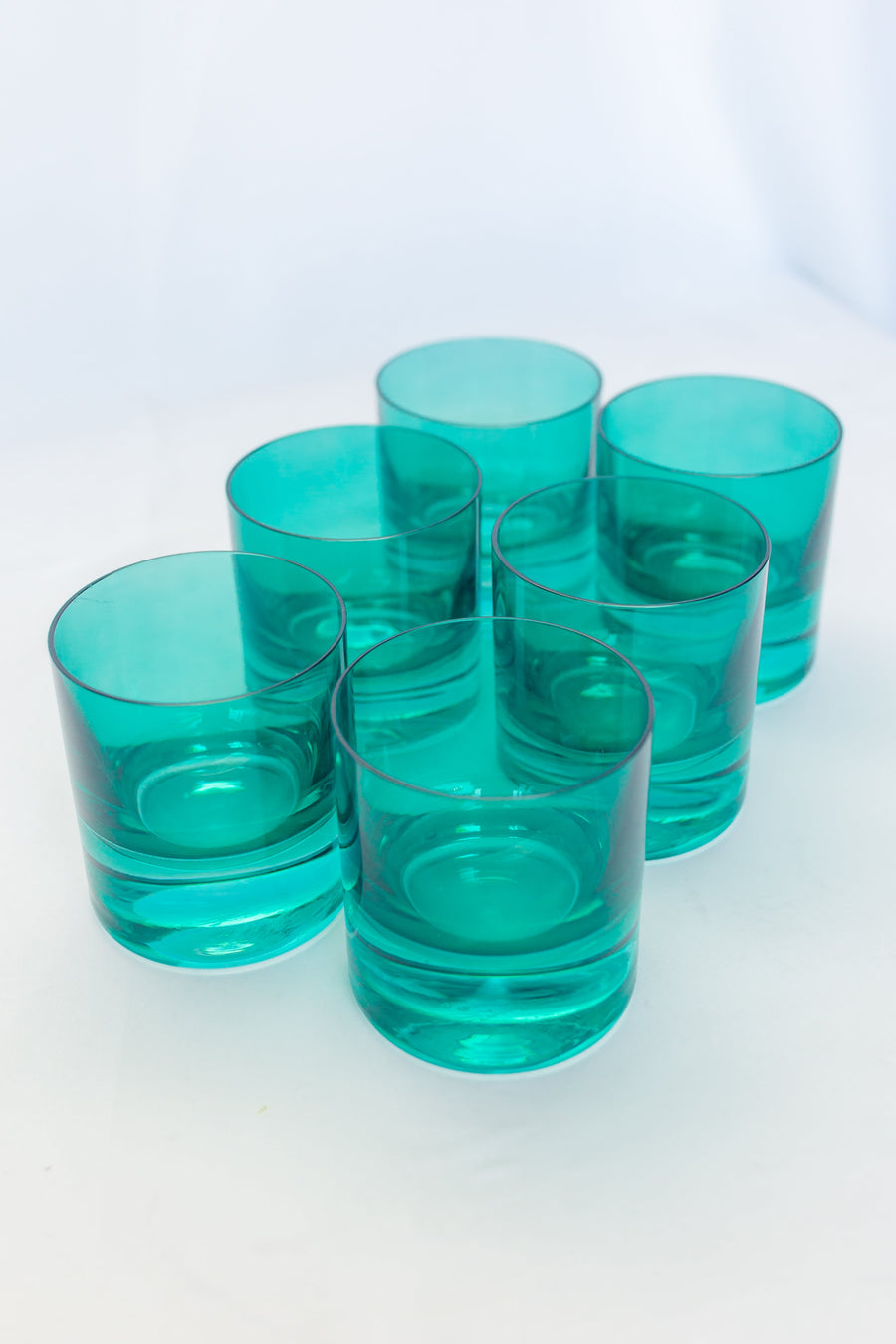 Elegant emerald green rocks glass showcasing exquisite craftsmanship and timeless style for sophisticated settings.