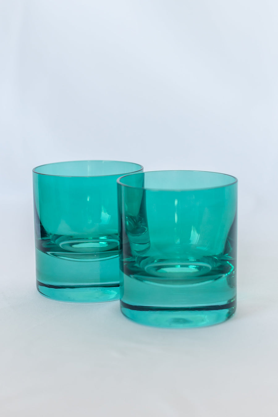 Emerald green rocks glass showcasing elegant design with vibrant color, perfect for sophisticated drinkware collections.