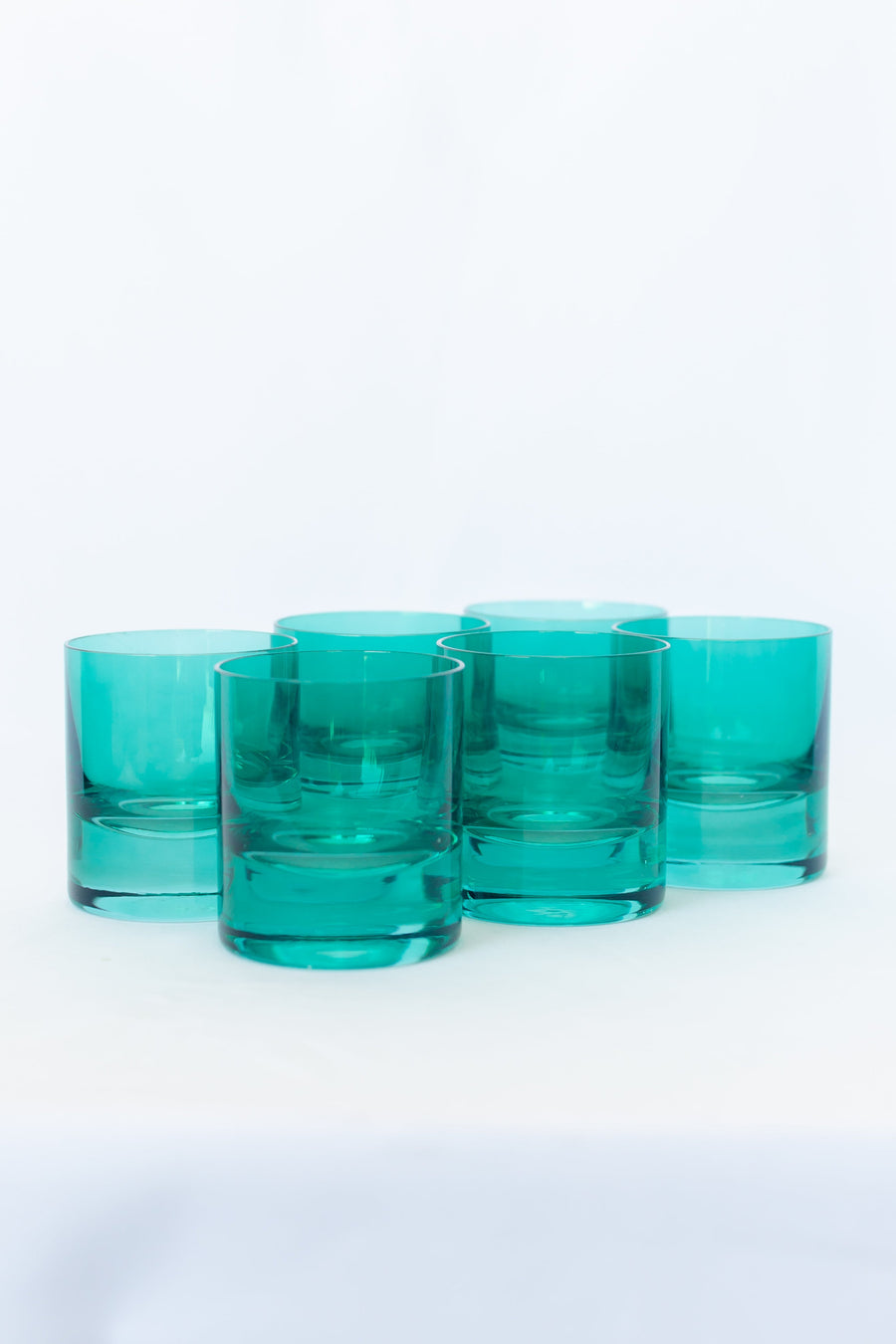 Elegant emerald green rocks glass showcasing exquisite craftsmanship and timeless style for sophisticated settings.