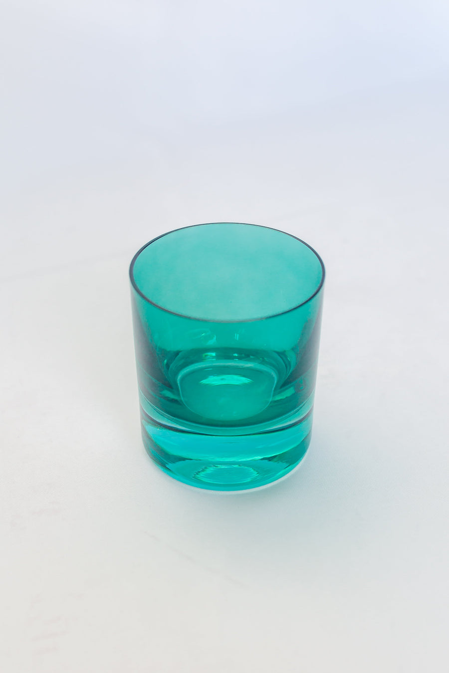 Elegant emerald green rocks glass showcasing exquisite craftsmanship and timeless style for sophisticated settings.