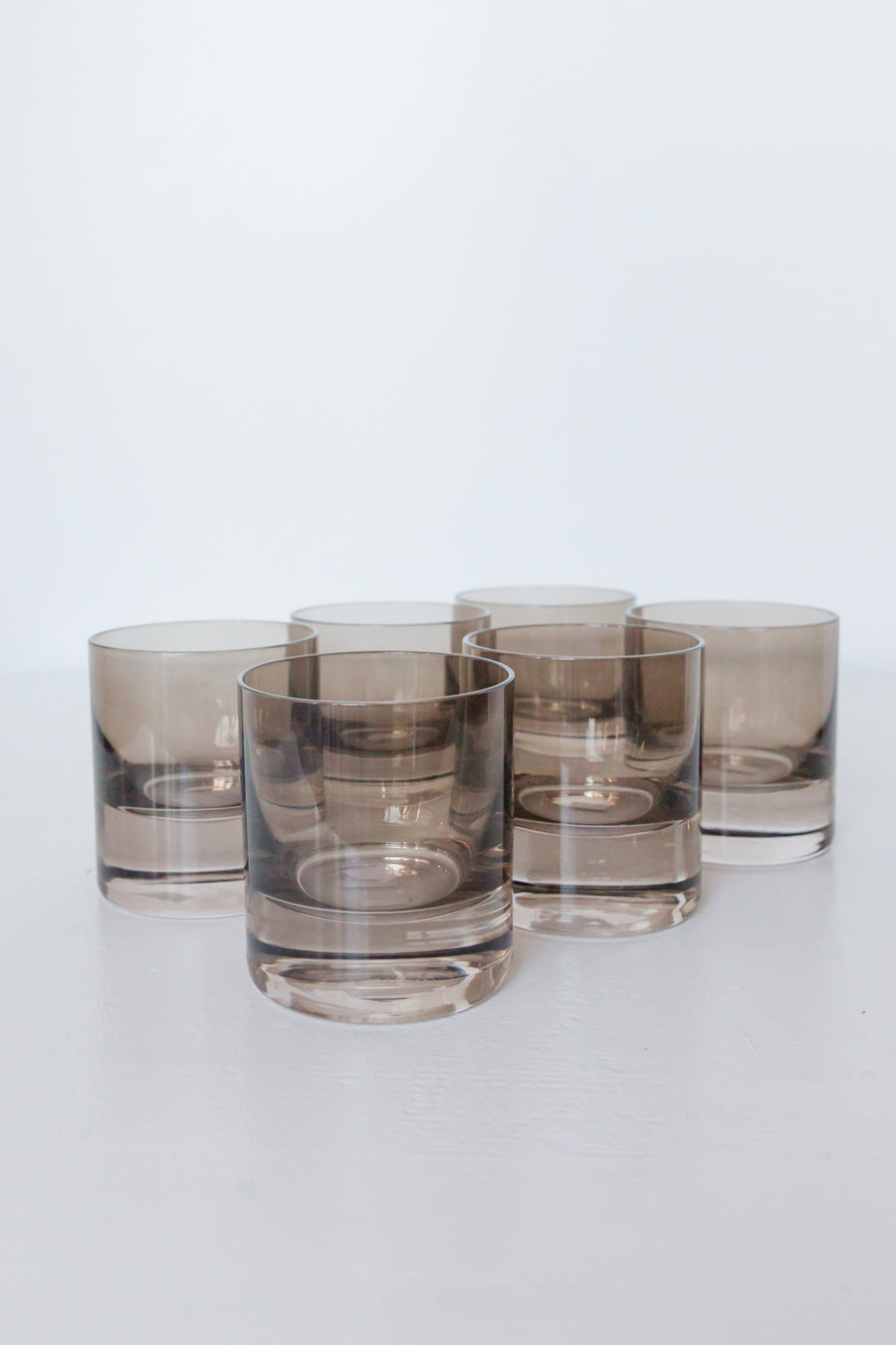Elegant colored rocks glass in gray smoke, perfect for sophisticated cocktail presentations and stylish home bars.