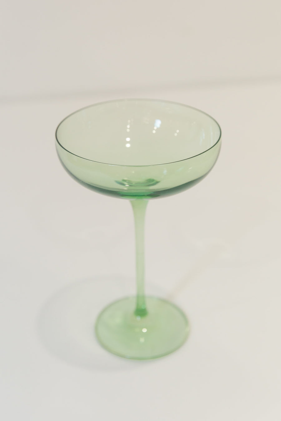 Mint green champagne coupes elegantly displayed for sophisticated event decor and stylish table settings.