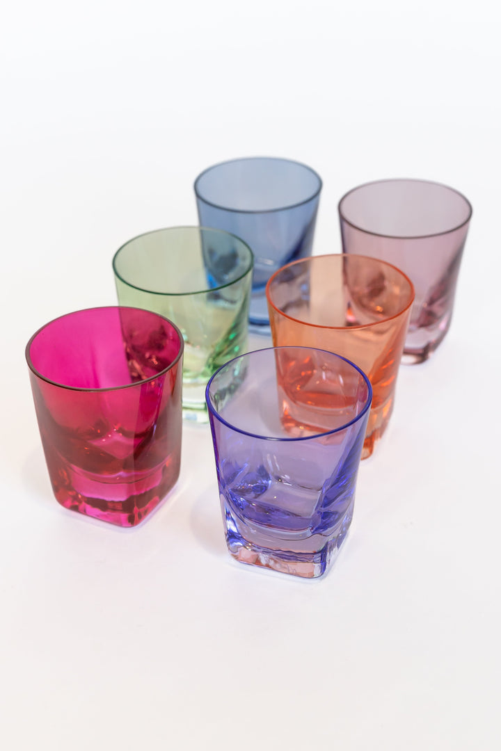 Vibrant colored shot glasses arranged elegantly for modern barware collection