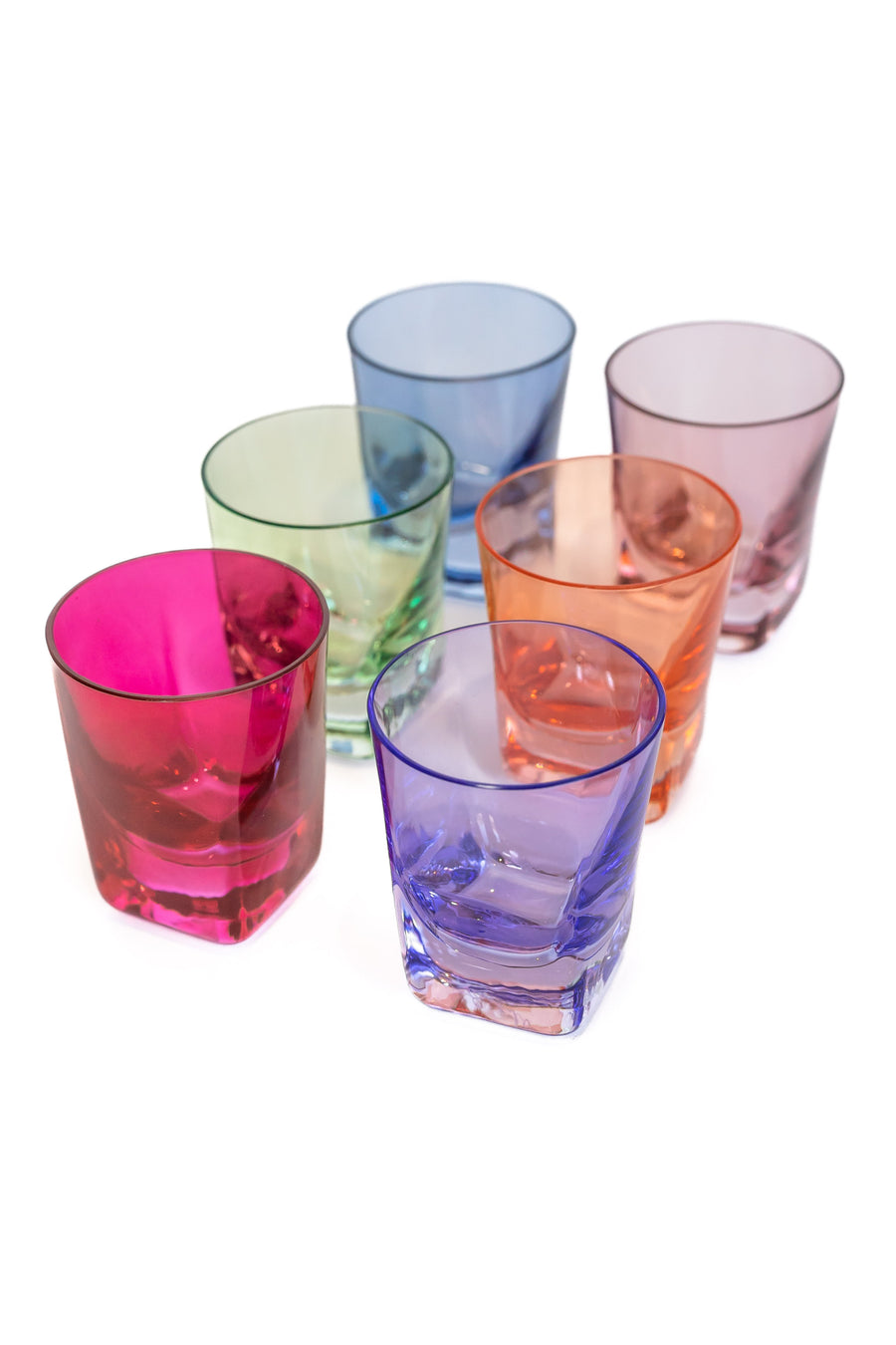 Vibrant colored shot glasses arranged elegantly for modern barware collection