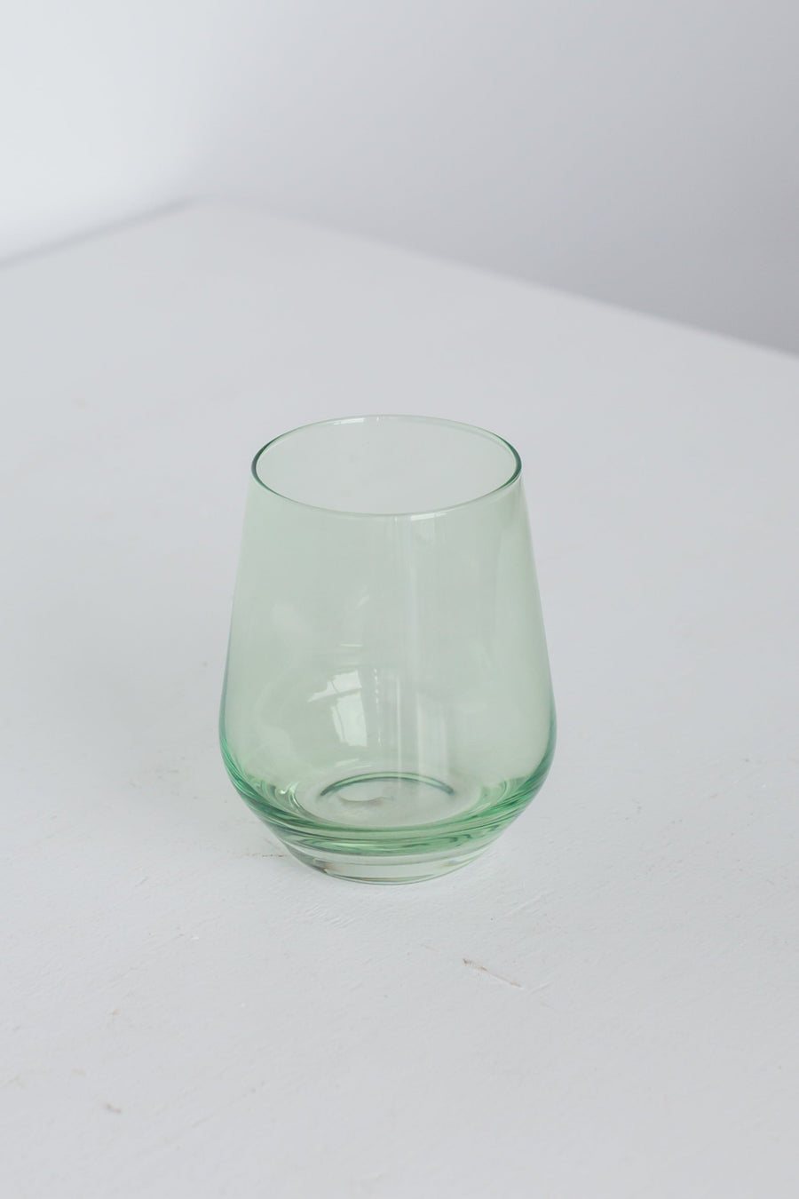 Elegant mint green stemless wine glasses perfect for stylish entertaining and modern table settings.