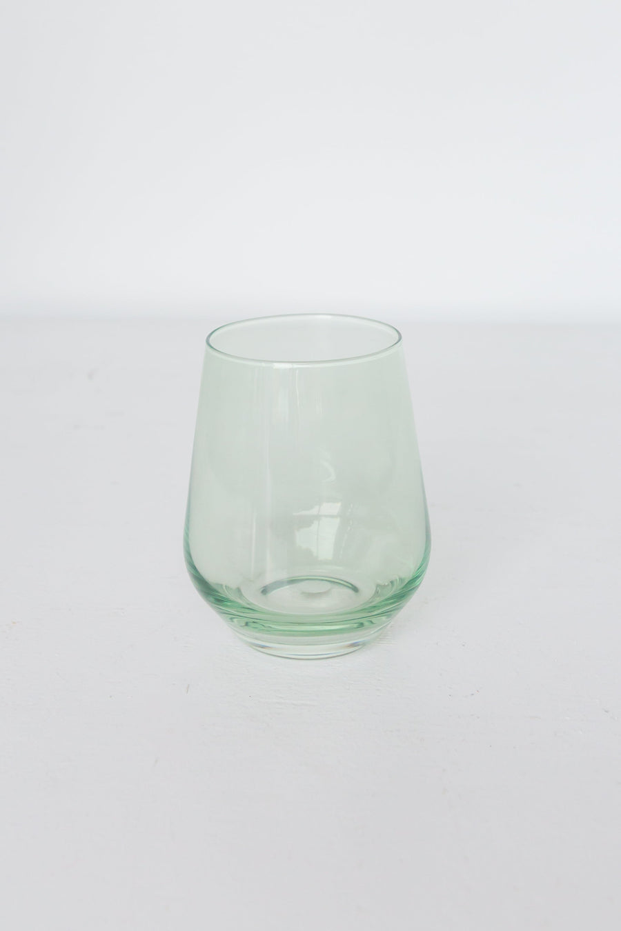 Elegant mint green stemless wine glasses perfect for stylish entertaining and modern table settings.