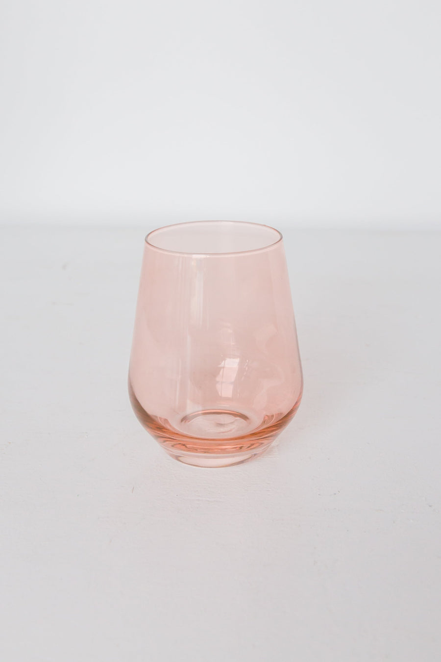 Elegant blush pink stemless wine glasses perfect for stylish entertaining and sophisticated table settings