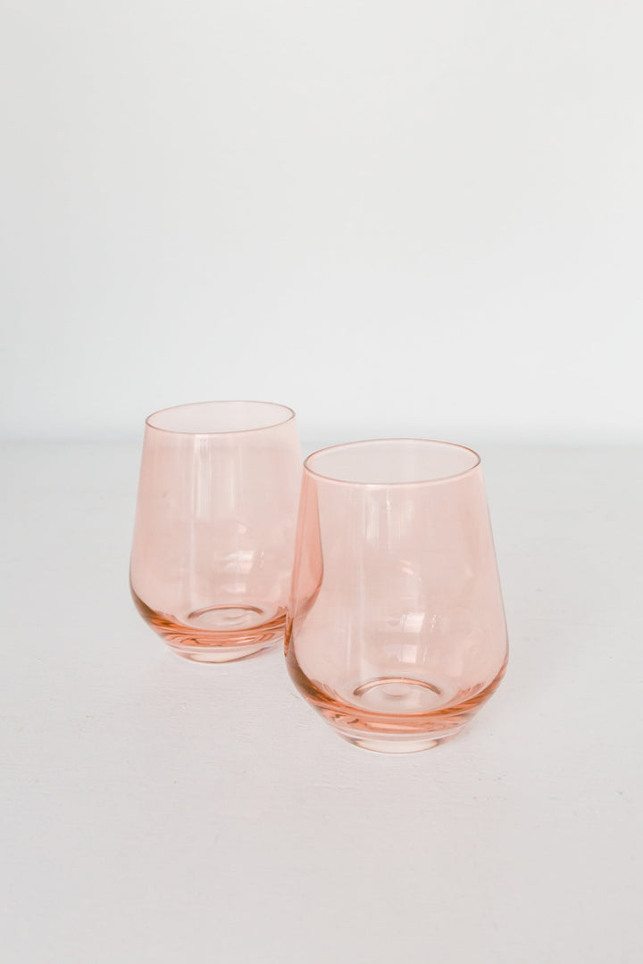 Elegant blush pink stemless wine glasses perfect for stylish entertaining and sophisticated table settings