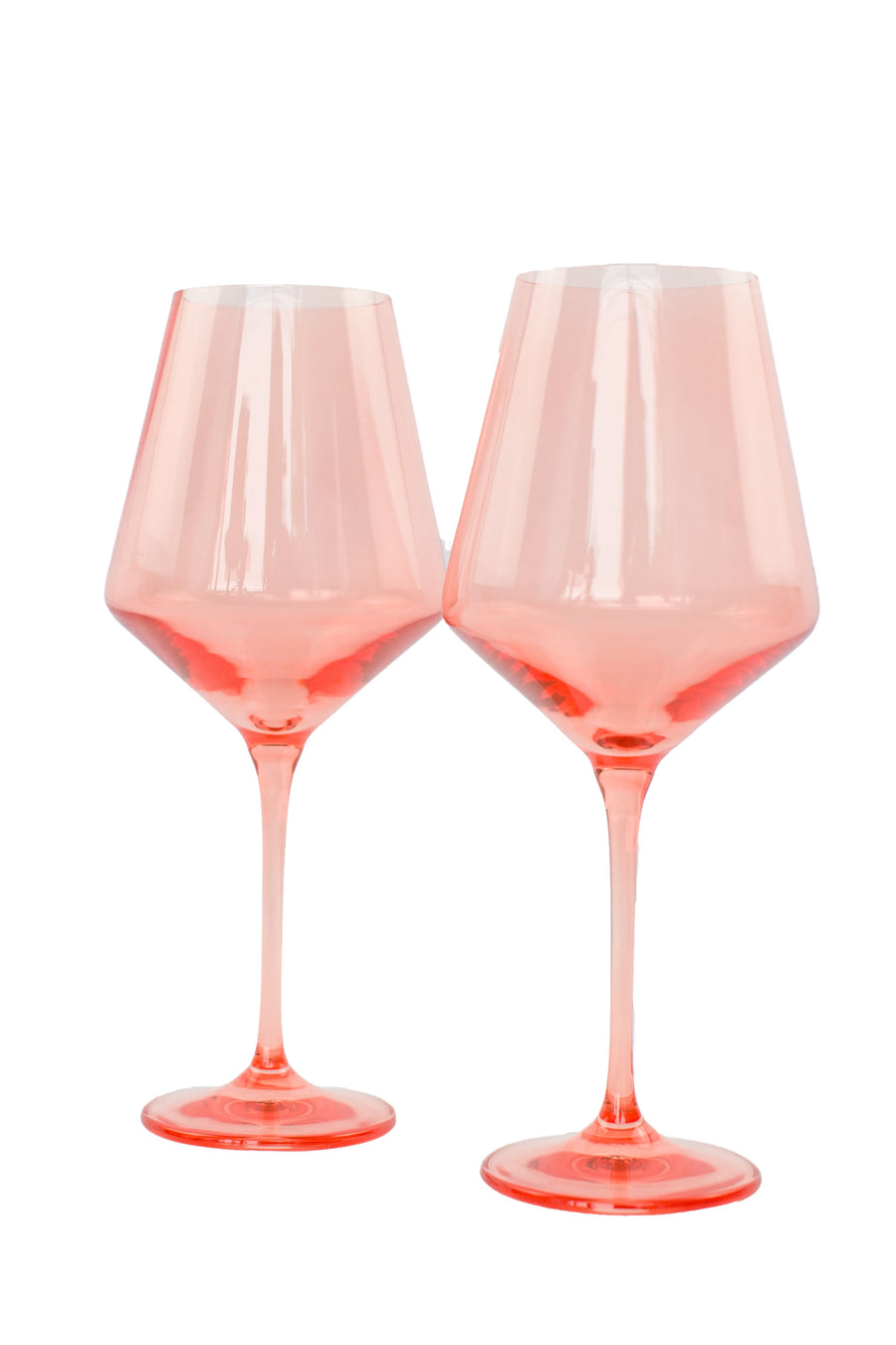 Colored wine stemware in peach fuzz hue enhancing elegant dining experiences
