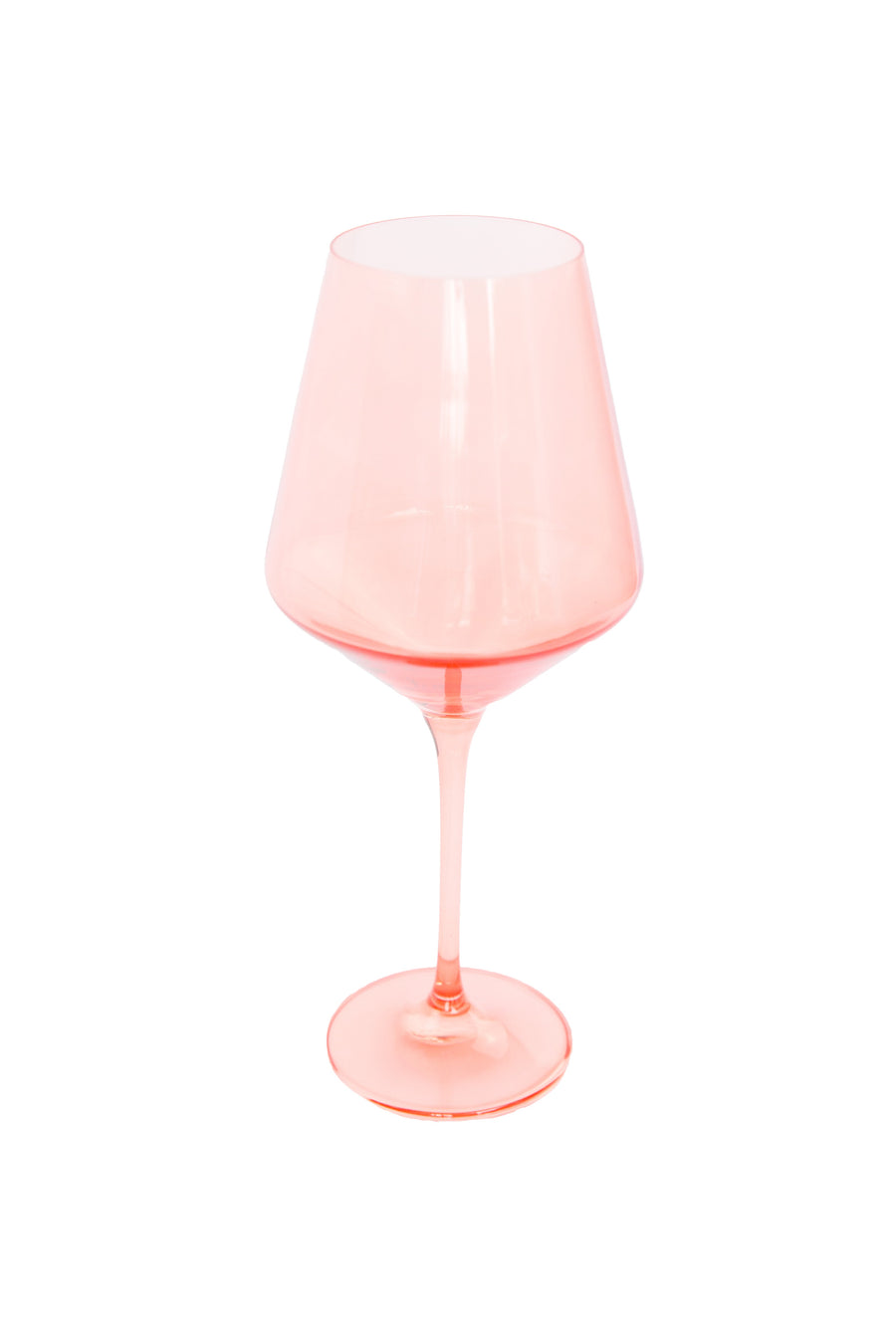 Colored wine stemware in peach fuzz hue enhancing elegant dining experiences